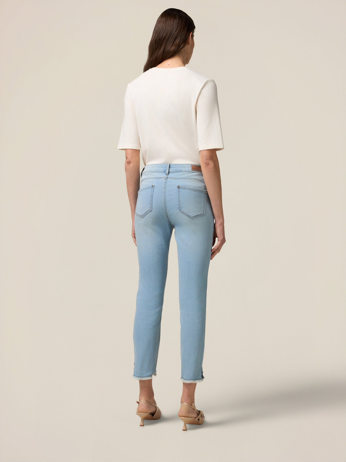 Skinny jeans with stone bleached effect and button details image number 1
