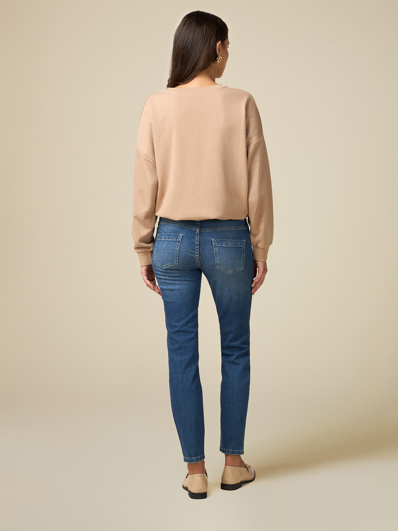 Jeans skinny con borchie applicate image number 1