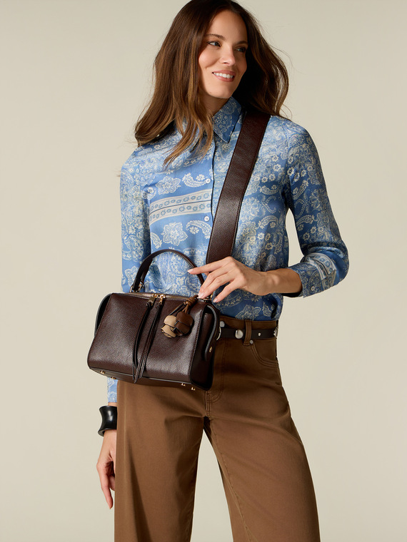 Top-handle bag with floral charm and tassels