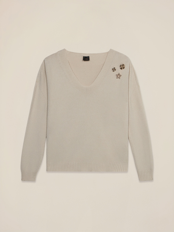 V-neck sweater with decorative pins
