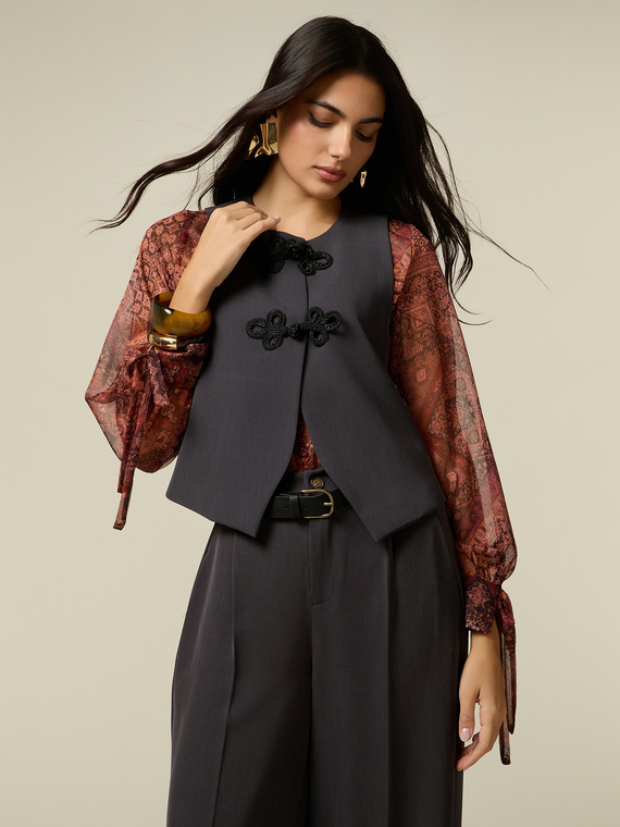 Short gilet with embroidered frog fastenings