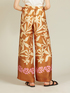 Pantaloni fluidi in raso fantasia image number 1