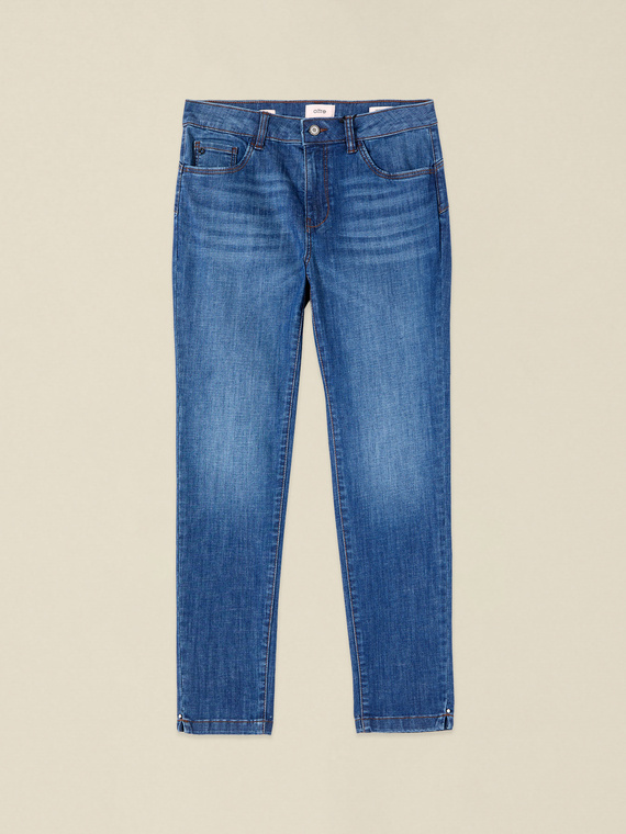 Washed skinny jeans with studs on the leg hem