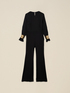 Jumpsuit with golden bracelets image number 3