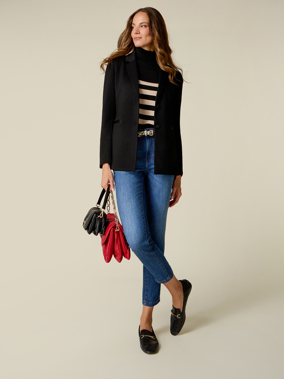 Washed skinny jeans with studs on the leg hem