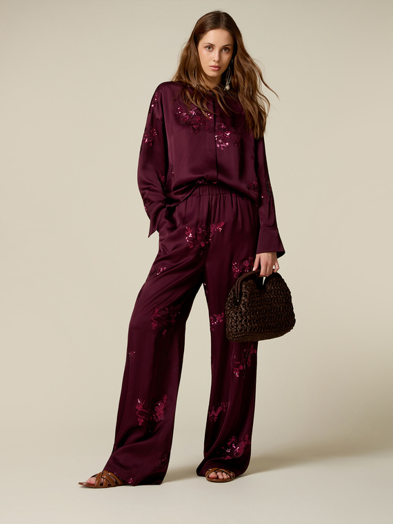 Pantaloni palazzo in raso con ricami in paillettes