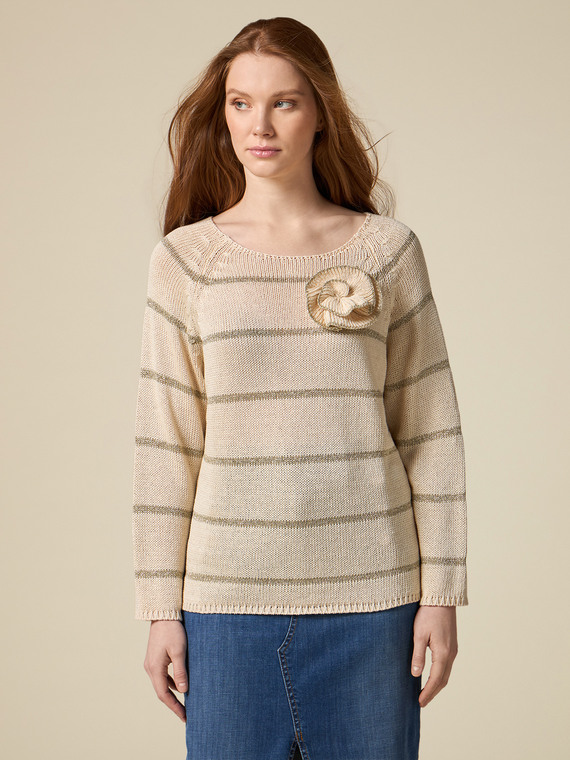 Striped sweater with flower brooch