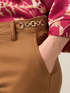 Chino pants with decorative chain image number 2