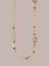 Halskette aus goldfarbener Kette und Steinen image number 1