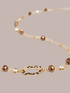 Halskette aus goldfarbener Kette und Steinen image number 2