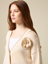 Oversized cardigan with flower brooch image number 2