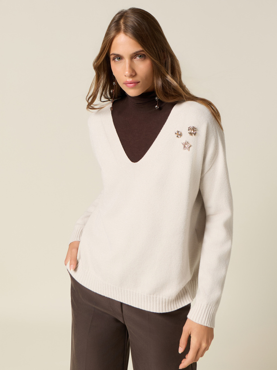 V-neck sweater with decorative pins