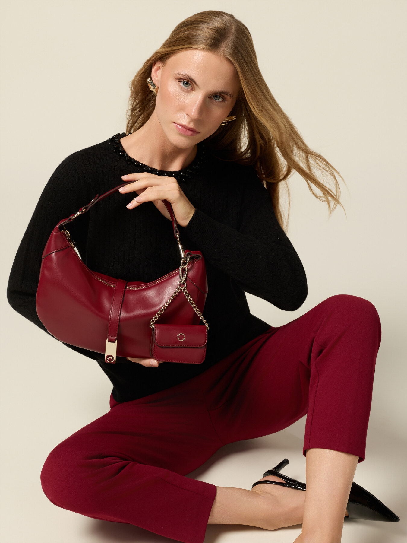 Shoulder bag with zip and metal charm image number 0