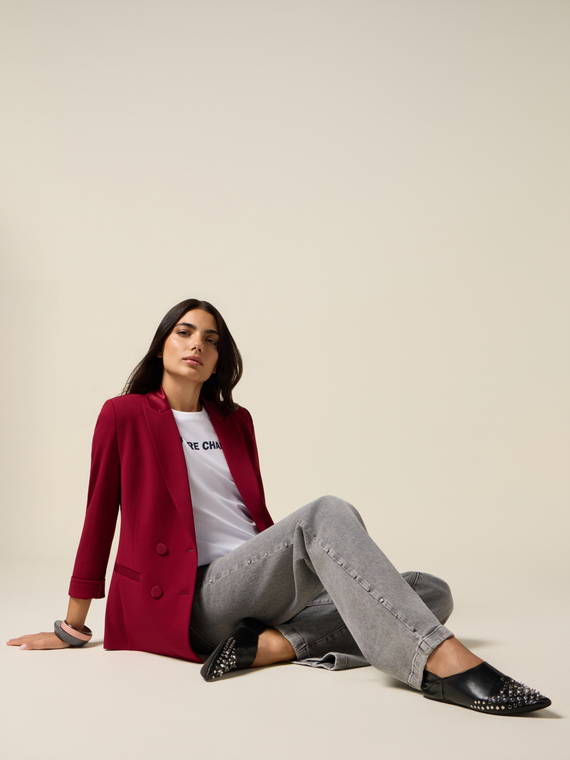 Jeans palazzo con tachuelas decorativas