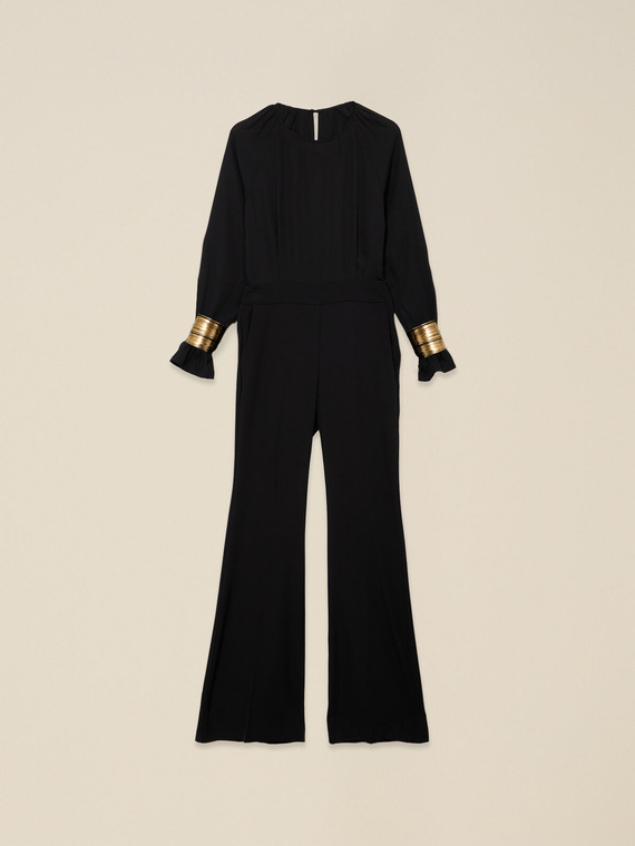 Jumpsuit with golden bracelets