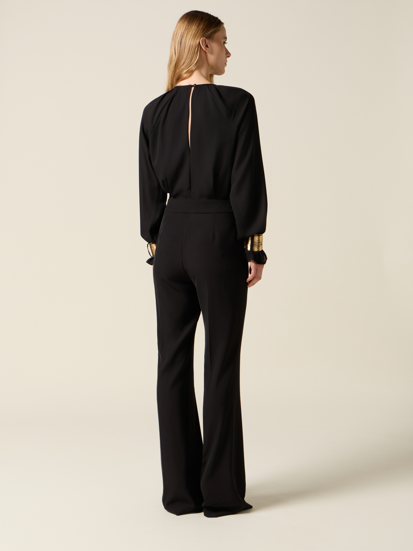 Jumpsuit with golden bracelets image number 1