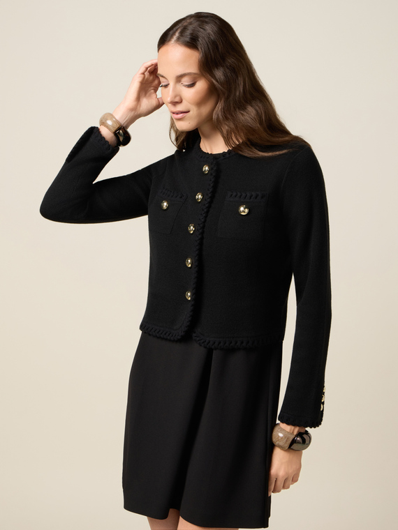 Knitted jacket with worked edges