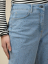 Jeans boyslim eco-friendly stone bleached con borchiette image number 2