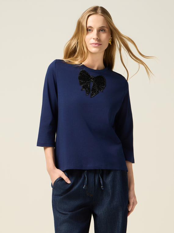 T-shirt con patch in paillettes