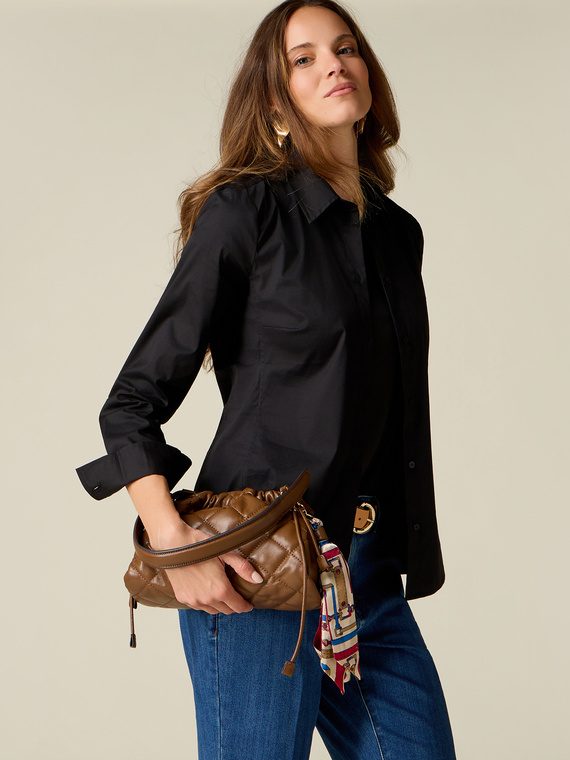 Quilted bag with drawstring and charm
