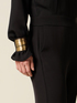 Jumpsuit with golden bracelets image number 2