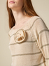 Striped sweater with flower brooch image number 2
