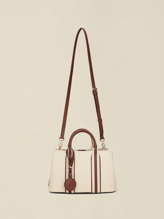 Two-tone barrel bag with charm